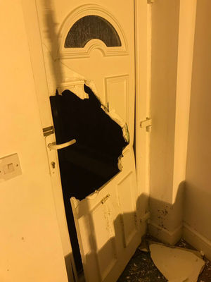 The front door was kicked in by intruders.