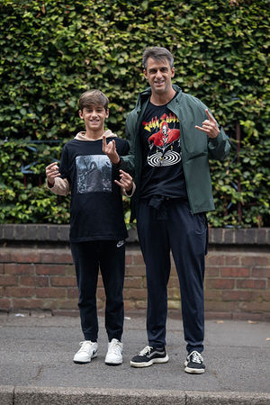 Father and son music fans, both named Joao Indiani, arrive to attend British rock band Black Sabbath's "Back to The Beginning" concert, Ozzy Osbourne's final ever gig as Black Sabbath's frontman at Villa Park in Birmingham, central England on July 5, 2025. Osbourne, who revealed in 2020 that he has Parkinson's disease, will join Tony Iommi, Geezer Butler and Bill Ward for the all-day "Back To The Beginning" show in Birmingham, central England, where the heavy metal giants formed in 1968. (Photo by Oli SCARFF / AFP) (Photo by OLI SCARFF/AFP via Getty Images)          