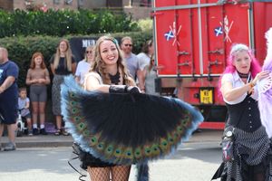 This carnival-goer was all smiles as she flapped her feathers