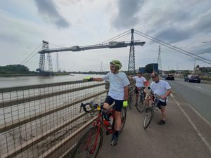 The riders taking a break iby the Transporter Bridge, South Wales
