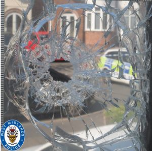 The bullet hole in the window