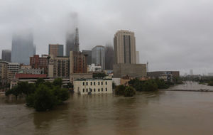 Floodwaters from Tropical Storm Harvey flow in the Buffalo Bayou in downtown Houston, Texas,