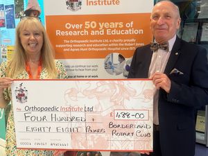 Supporting image for story: Rotary presents cheque to county charity