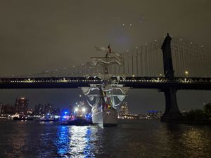 A Mexican navy ship sits in the water after it hit the Brooklyn Bridge