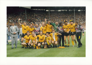 Hobbling into the celebration photo after Wolves beat Burnley at Wembley.