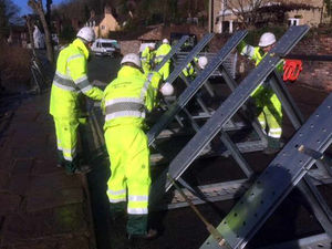 Supporting image for story: Pictures and video: Ironbridge flood barriers go back up as river in Shropshire hits highest levels of the winter
