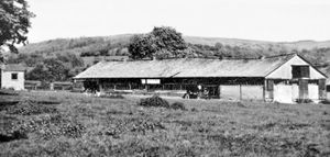 "View looking north east over the present day sheds towards the Brown Clee. Note the guard house on the left."