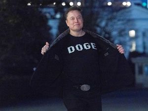 Elon Musk wearing a DOGE T-shirt