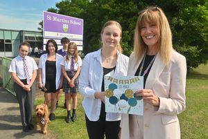 Headteacher at St Martins School Sue Lovecy (right) receives a 'thank you' card from pupils. Pictured with Sue is Aleksandra Muryshkina, 17