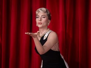 Supporting image for story: Lady Gaga blows kiss and wears black gown in waxwork unveiled at Madame Tussauds