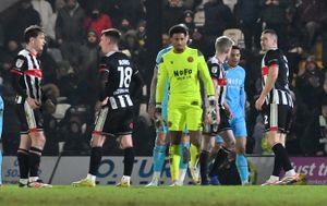 Goalkeeper Myles Roberts was sent off for Walsall before half-time.