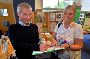 Councillor Eileen Moore gets Brian Bunar to sign up for the Parish Council Environment Working Group.