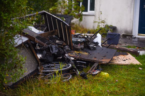 Debris could be seen outside the property, off Aldersmead Road, on Friday morning. Photo: SnapperSK