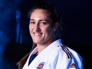 Supporting image for story: Denise Lewis gold lit Olympic flame inside Natalie Powell