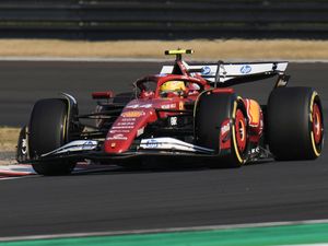 Ferrari driver Lewis Hamilton of Britain steers his car during the sprint qualifying at the Chinese Grand Prix