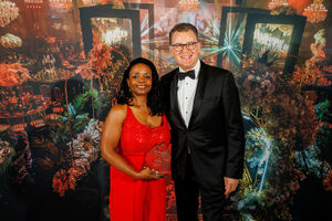 Maxine Faulder receives her Influencer of the Year Award from Dave Sharpe.