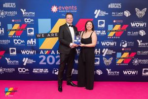 Harrison Carloss Directors Adam Mobley (Left) and Rebecca Cox (Right) celebrate the award win.