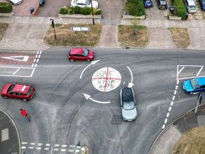 Supporting image for story: Left-wing activists vandalise mini-roundabout with 'Love All Stop Hate' graffiti tag
