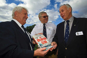 Goldfish Club members Stu Clay, Steve Hart and Art Stacey exchange gifts at their reunion in Telford