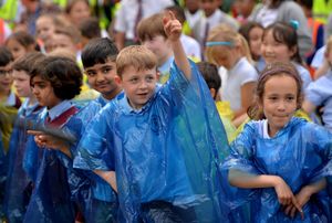 Schoolchildren got into the swing of things despite the weather