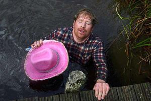 A competitor celebrates after taking part