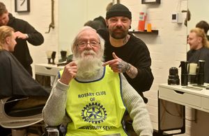 'Santa' aka Peter Love, with barber Mat Glover