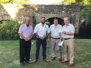 Road run organisers Ivor Davies and John Edwards presenting cheque to Sam Stables and Neil Wright for Farming Minds 