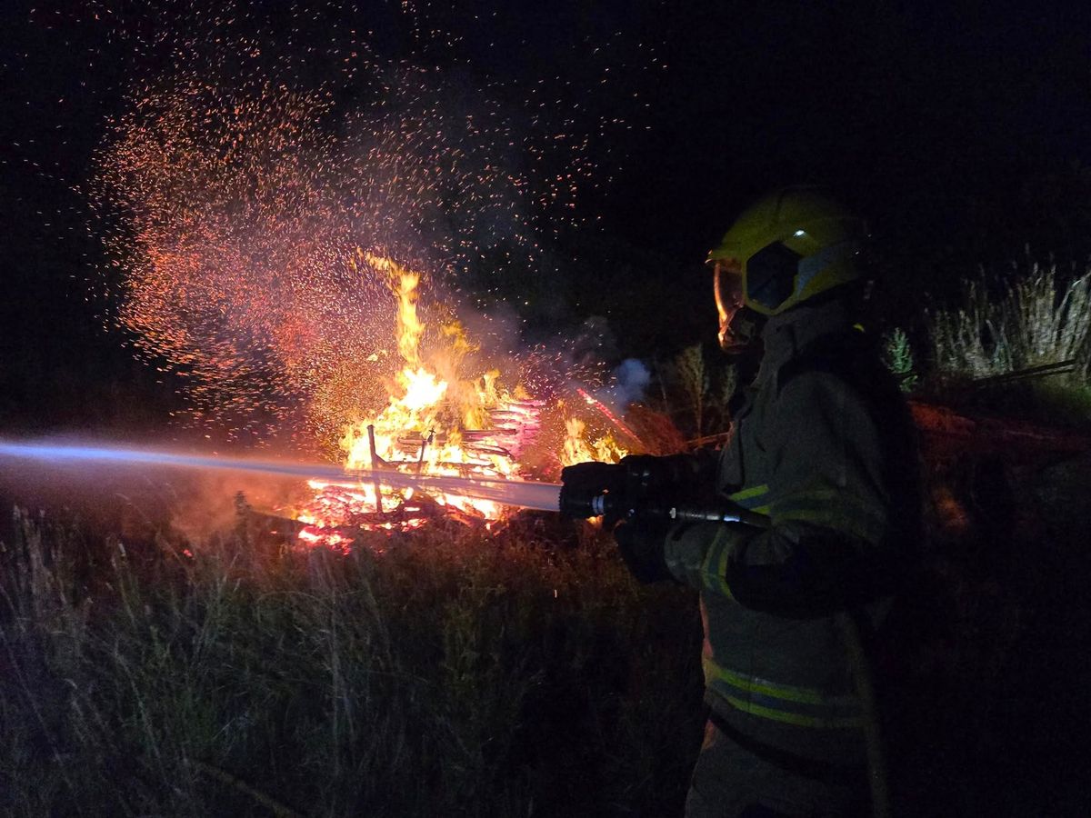In pictures: Firefighters battle to stop blaze spreading to nearby fields and buildings near Oswestry