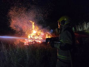 Supporting image for story: In pictures: Firefighters battle to stop blaze spreading to nearby fields and buildings near Oswestry