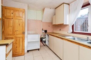 A practical kitchen space with garden views and easy outdoor access