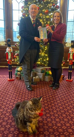 North Shropshire MP Helen Morgan (right) shows Mr Lindsay Hoyle the winning Christmas card design.