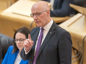 First Minister John Swinney speaks in the Scottish Parliament