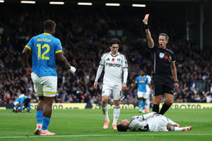 LONDON, ENGLAND - NOVEMBER 01: Referee John Brooks shows a red card to Emmanuel Agbadou of Wolverhampton Wanderers during the Premier League match between Fulham and Wolverhampton Wanderers at Craven Cottage on November 01, 2025 in London, England. (Photo by Dan Istitene/Getty Images)