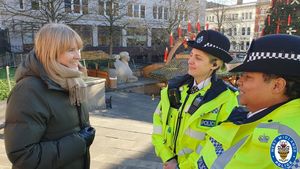 Policing minister Sarah Jones with Superintendent Sam Batey and Chief Inspector Vicki Stott