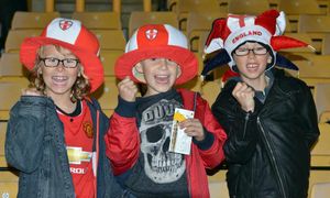 Three youngsters celebrate the victorious England match.