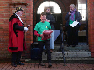 Geoff Cooper was presented with a Paramo walking jacket by Ali Allen of Kington’s Walking Hub. He won the jacket for one of his pictures which won the walking festival's photography competition. Image by Andy Compton