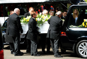 The funeral procession arrive