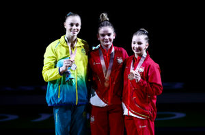 Alice Kinsella (centre) with her gold medal