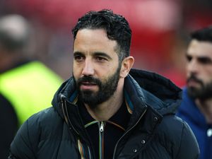 Manchester United manager Ruben Amorim looks on