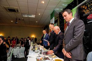The top table say grace before their meal in the Premier Suite