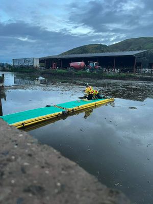 Two firefighters went out over the slurry pit on an inflatable skid. Photo: @SFRS_WL_oncall