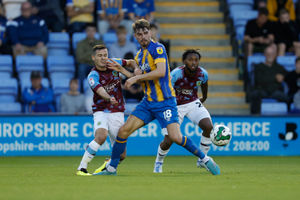 Tom Bloxham of Shrewsbury Town and Josh Cullen of Burnley (AMA)