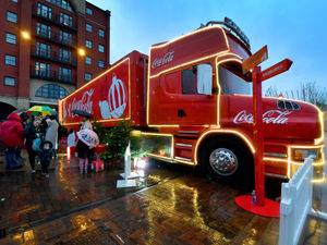 Supporting image for story: 'Rain won't stop us!' Hundreds turn up to welcome famous Christmas Coca-Cola truck to Wolverhampton