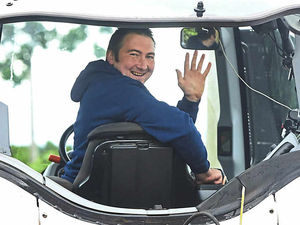 Supporting image for story: Paralysed farmer using tractor chair lift to help bring in harvest