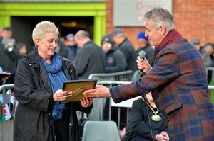 Clive Knowles gives Councillor Joy Jones a certificate to mark the unveiling