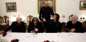 Ozzy and the rest of Sabbath being presented with the trainers - picture Lux Group