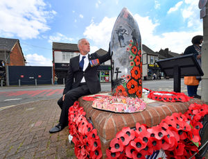 Councillor Stuart Henley examines the shell at Shell Corner in Halesowen