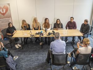 Supporting image for story: Bereaved mothers hold up 56 babygrows in ’emotional’ meeting with Wes Streeting