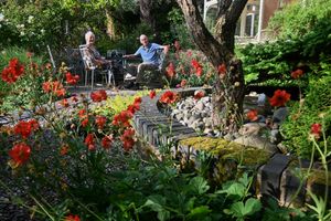 George and Fiona Chancellor in their garden at Windy Ridge in Little Wenlock