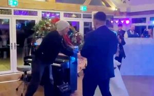 An image shows Coldplay's Chris Martin with a Staffordshire couple after his surprise performance at their weeding.